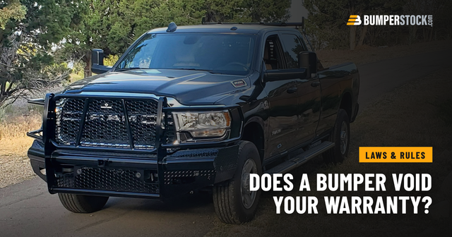 A customer's black Ram 3500 with a Ranch Hand Legend steel front bumper, parked on a gravel road under trees