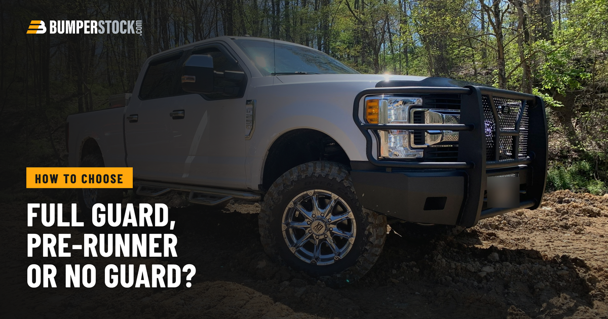 A customer's white Ford Super Duty with a Steelcraft Elevation front bumper and full grille guard, parked on dirt in the woods