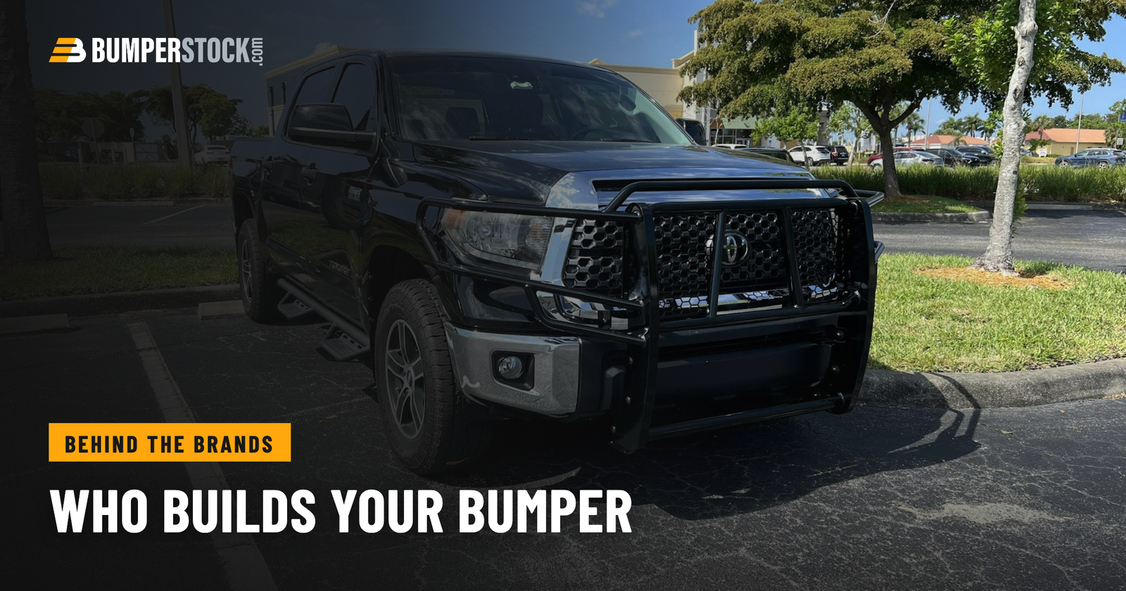Black Toyota Tundra with an aftermarket steel front bumper and full grille guard