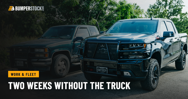 Two work trucks parked on gravel, both wearing steel front bumpers with full grille guards over the headlights